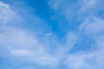 Blue sky background with white clouds.