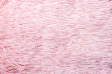 Trendy pink artificial fur texture. Fur pattern top view. Pink fur background. Texture of pink shaggy fur. Wool texture. Flaffy sheepskin close up