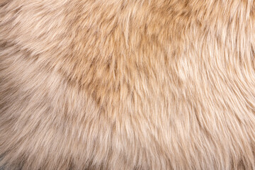 Trendy brown artificial fur texture. Fur pattern top view. Brown fur background. Texture of beige shaggy fur. Wool texture. Flaffy sheepskin close up