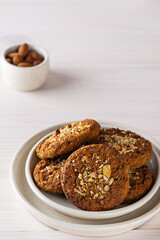 Cereal cookies in a light plate. Sugar, gluten, lactose free, vegan.