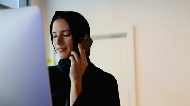 Beautiful Arab Middle Eastern woman on Abaya and Hijab ideal for modern business concept