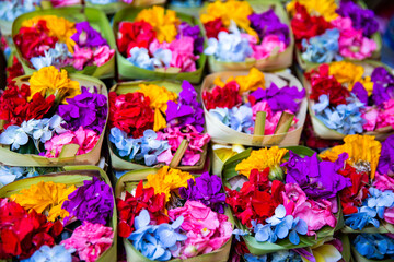 Fototapeta na wymiar Traditional balinese offerings to gods in Bali with flowers.