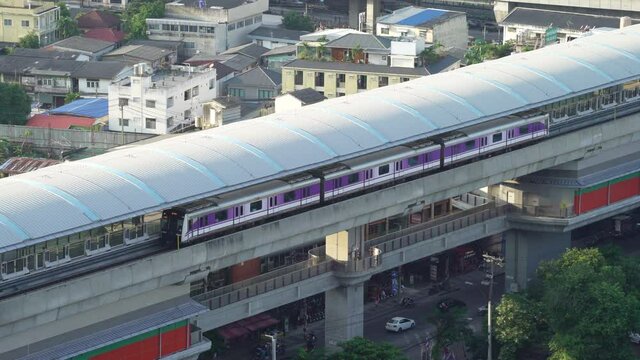 BANGKOK, THAILAND - NOVEMBER 10, 2021: Close up of Bangkok MRT Purple Line Departing from Bangson Station.