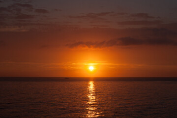 Fototapeta na wymiar sunset on the sea in Adler in yellow and brown tones