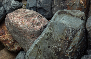 Sand and different stone pebbles as background. 
