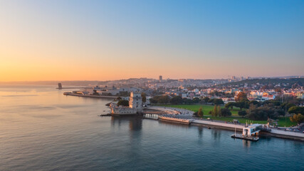 Fototapeta na wymiar Aerial view of the Portuguese Historical Folk Patrimony, Belem Tower, on the Tagus River. During sunset.