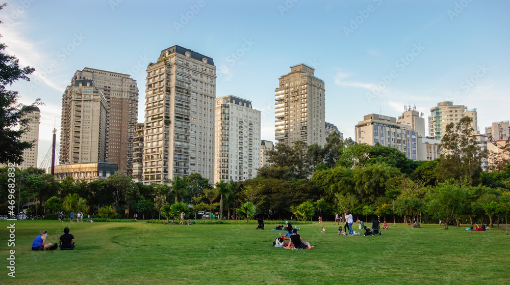 Wall mural sao paulo, brazil: people having leisure on sunny afternoon in parque do povo city park