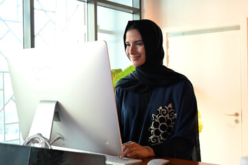 Beautiful Arab Middle Eastern woman on Abaya and Hijab ideal for modern business concept