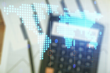 Abstract creative digital world map on blurry calculator and papers background, globalization...