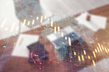 Multi exposure of abstract financial diagram with world map and modern desk with computer on background, banking and accounting concept