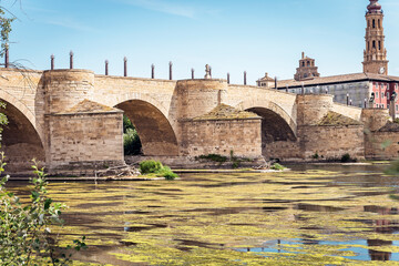 view of stone bridge in Zaragoza city, from the ebro river. Spain