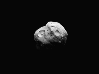 Asteroid isolated on a black background. Rocky surface of a large asteroid with craters.	