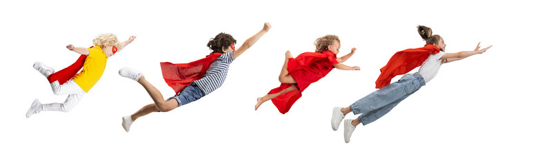 Collage of four children, boys and girls flying like Superman in red cape isolated over white...