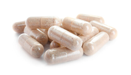 Many transparent gelatin capsules on white background