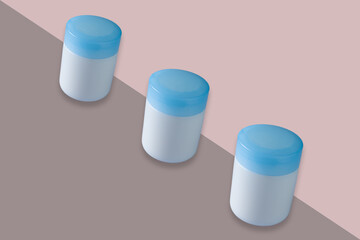 Cosmetic jars with blue cap mockup isolated on bicolor background