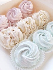 Homemade marshmallows in a white box. Marshmallow roses. A close-up shot.