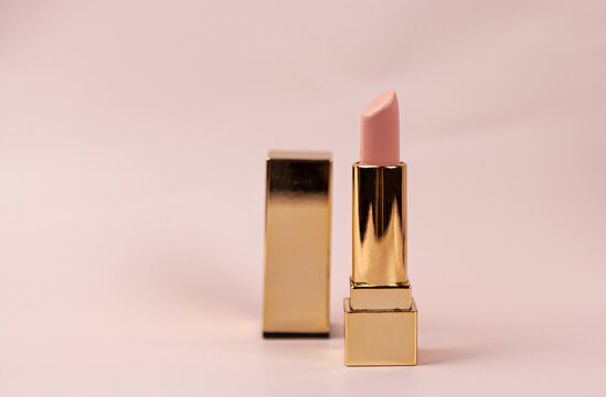 beautiful modern minimal nude lipstick makeup cosmetic beige background