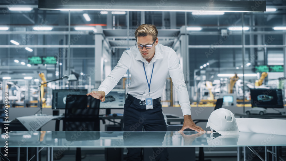 Aufkleber confident engineer in white shirt making gestures of moving invisible object in virtual reality in a