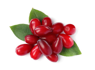 Pile of fresh ripe dogwood berries with green leaves on white background, top view