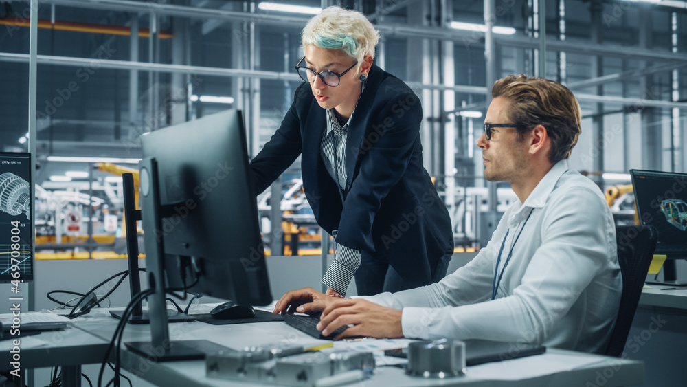 Poster Two Automotive Engineers Discussing Concept Car Blueprints on Desktop Computer in Modern Office at Assembly Plant. Female Industrial Project Manager Talk to Male Designer at Vehicle Factory.
