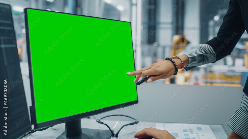 Poster vehicle factory line operator working at desk with computer with green screen template display great