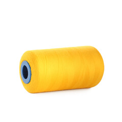 Spool of yellow sewing thread isolated on white