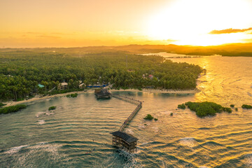 Sunset at Cloud Nine Surfing Area, Siargao Island, Philippines. Aerial Drone shot.