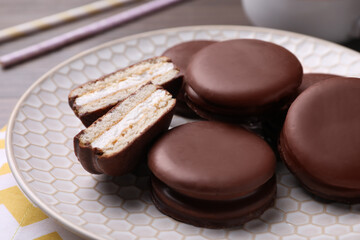 Tasty choco pies on plate, closeup view