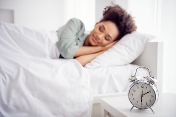 Portrait of attractive dreamy calm wavy-haired girl lying in bed sleeping early at light home house indoors