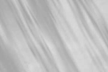 Obraz premium tree shadow on white concrete wall background and texture. abstract shadow on cement wall.