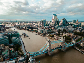 Aerial view to the Tower Bridge and London city Business center , UK, just before sunset. Traffic going across the bridge.