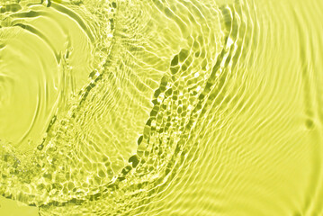 Aqua waves on a light green background. Light and shadows. Water spills on a light yellow background. Natural sunlight and shade. Minimal style.