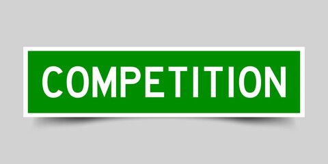 Square label sticker with word competition in green color on gray background