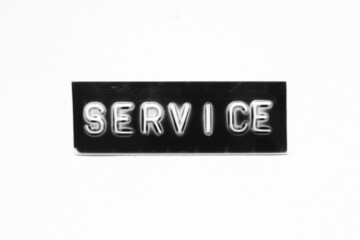 Black color banner that have embossed letter with word service on white paper background
