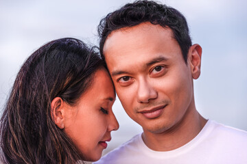 couple and family concept -close up portrait of young malaysian couple in love outdoor
