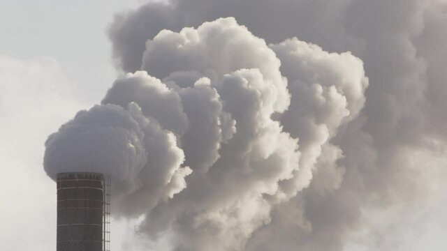 EPIC thick billowing smoke from an industrial chimney