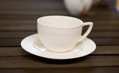 white tea set on a wooden table