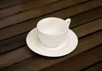 white tea set on a wooden table