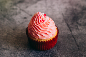 Delicious cupcakes. Cupcakes on a concrete table