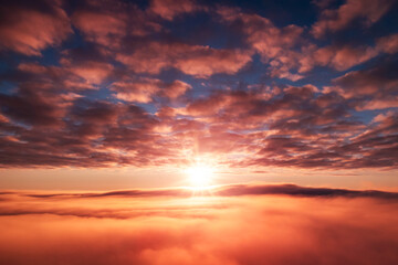 Fototapeta na wymiar Morning shot of rising sun over the fog. Beautiful dream-like shot in the sky