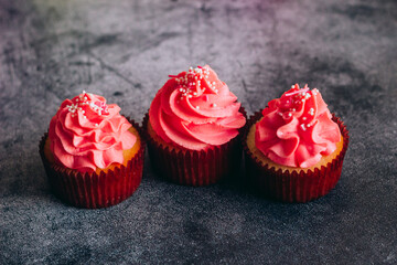 Delicious cupcakes. Cupcakes on a concrete table