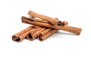 Herb, heap of dried cinnamon bark, isolated on a white background.