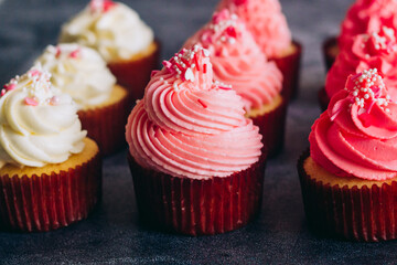 Delicious cupcakes. Cupcakes on a concrete table