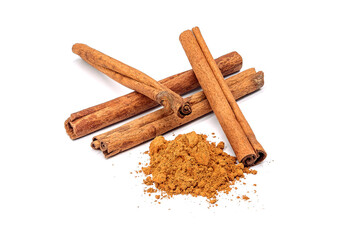 Herb, heap of dried cinnamon bark and powdered cinnamon, isolated on a white background.