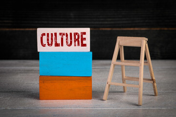 Culture. Development and success concept. Colored wooden blocks in a pile and stairs