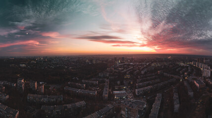 Aerial scenic vivid sunset panorama wide view with epic skyscape. Kharkiv city center, Pavlove pole...