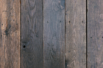 Wet old vintage dark brown wooden planks background.
