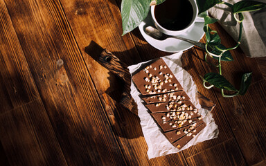 Fototapeta na wymiar healthy natural chocolate on a wooden background