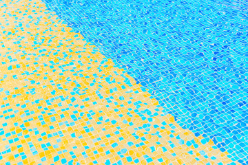 Swimming pool bottom. Summer background. Texture of water surface. 
