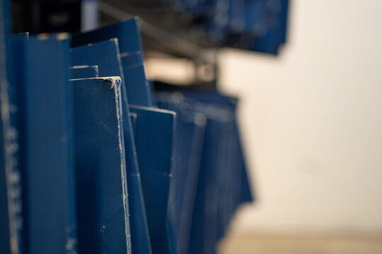 Old blue folder on the shelf in the storage room. Untidy storage.